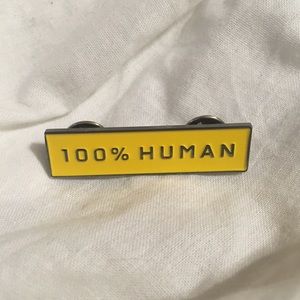 Everlane 100% Human pin in yellow